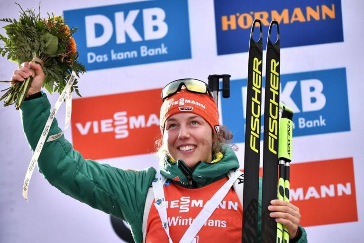 Runner up Germany's Laura Dahlmeier celebrates on the podium after the women's 10km pursuit event of the IBU Biathlon World Cup in Rasen-Antholz (Rasun Anterselva), Italian Alps, on January 26, 2019. Marco BERTORELLO / AFP