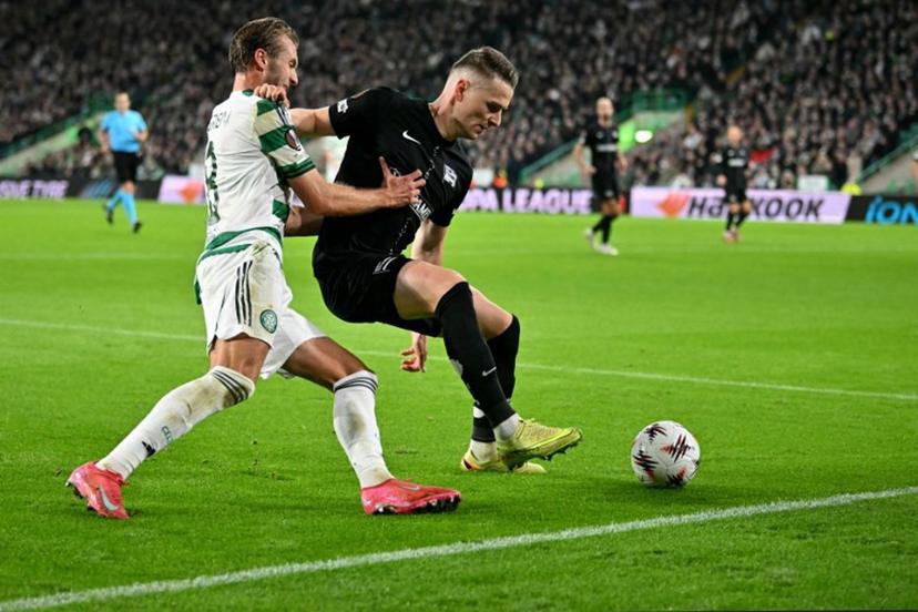 Celtic's Swedish midfielder #08 Benjamin Nygren battles for the ball with Sturm Graz's Belgian defender #24 Dimitri Lavalee during the UEFA Europa League league-stage football match between Celtic and Sturm Graz at Celtic Park in Glasgow on October 23, 2025. ANDY BUCHANAN / AFP
