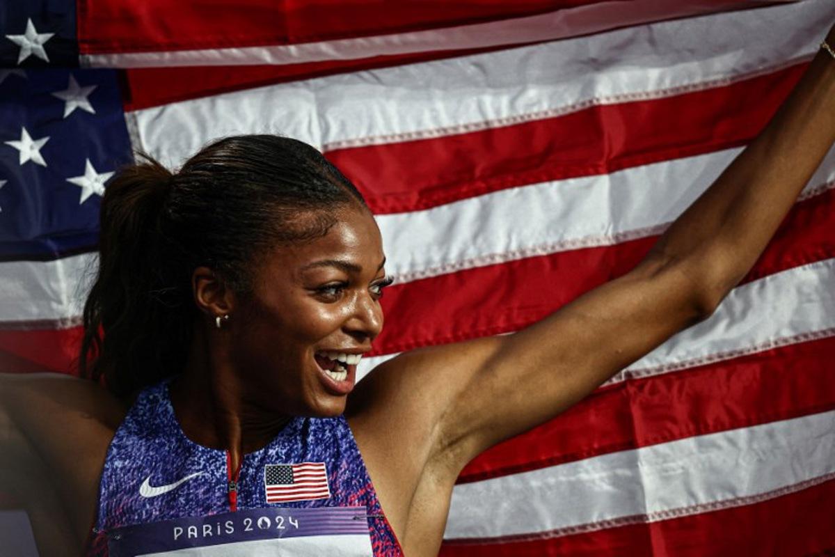 US' Gabrielle Thomas celebrates winning the women's 200m final of the athletics event at the Paris 2024 Olympic Games at Stade de France in Saint-Denis, north of Paris, on August 6, 2024. Anne-Christine POUJOULAT / AFP