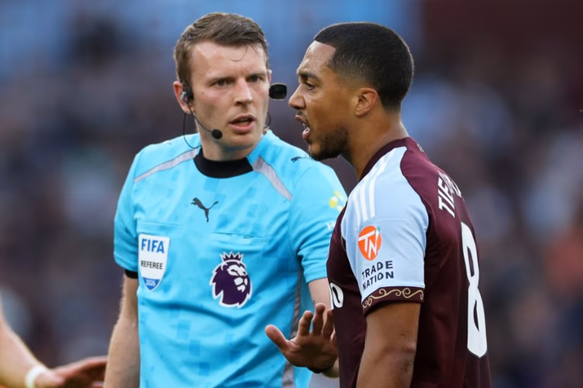 Referee Sam Barrott speaks with Aston Villa's Belgian midfielder #08 Youri Tielemans (R) during the English Premier League football match between Aston Villa and Tottenham Hotspur at Villa Park in Birmingham, central England on May 3, 2026. Adrian Dennis / AFP