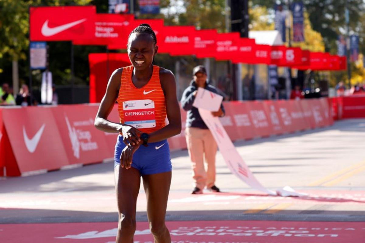 Kenya's Ruth Chepngetich reacts after crossing the finish line to place first in the women's division of the 2022 Bank of America Chicago Marathon in Chicago, Illinois, on October 9, 2022. KAMIL KRZACZYNSKI / AFP