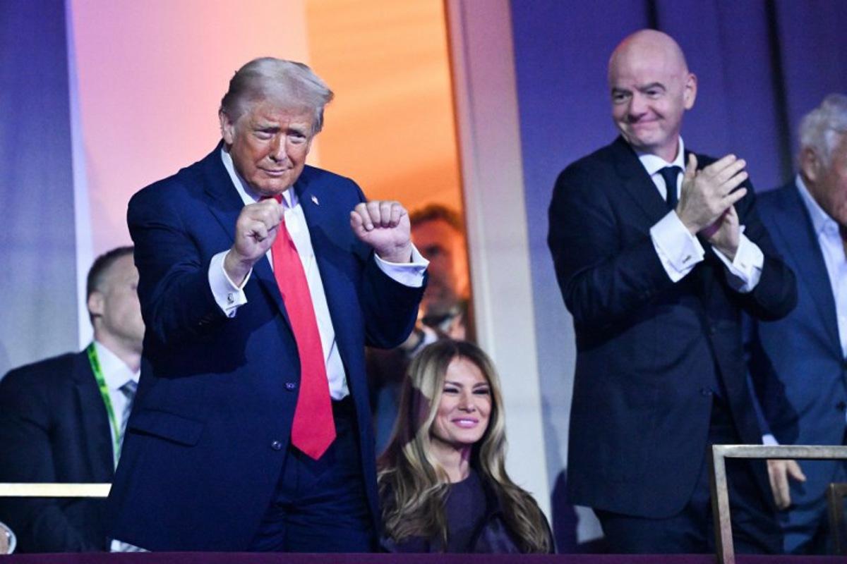 US President Donald Trump dances as US Musical Group The Village People perform the song "YMCA" during the draw for the 2026 FIFA Football World Cup taking place in the US, Canada and Mexico, at the Kennedy Center, in Washington, DC, on December 5, 2025. Mandel NGAN / POOL / AFP