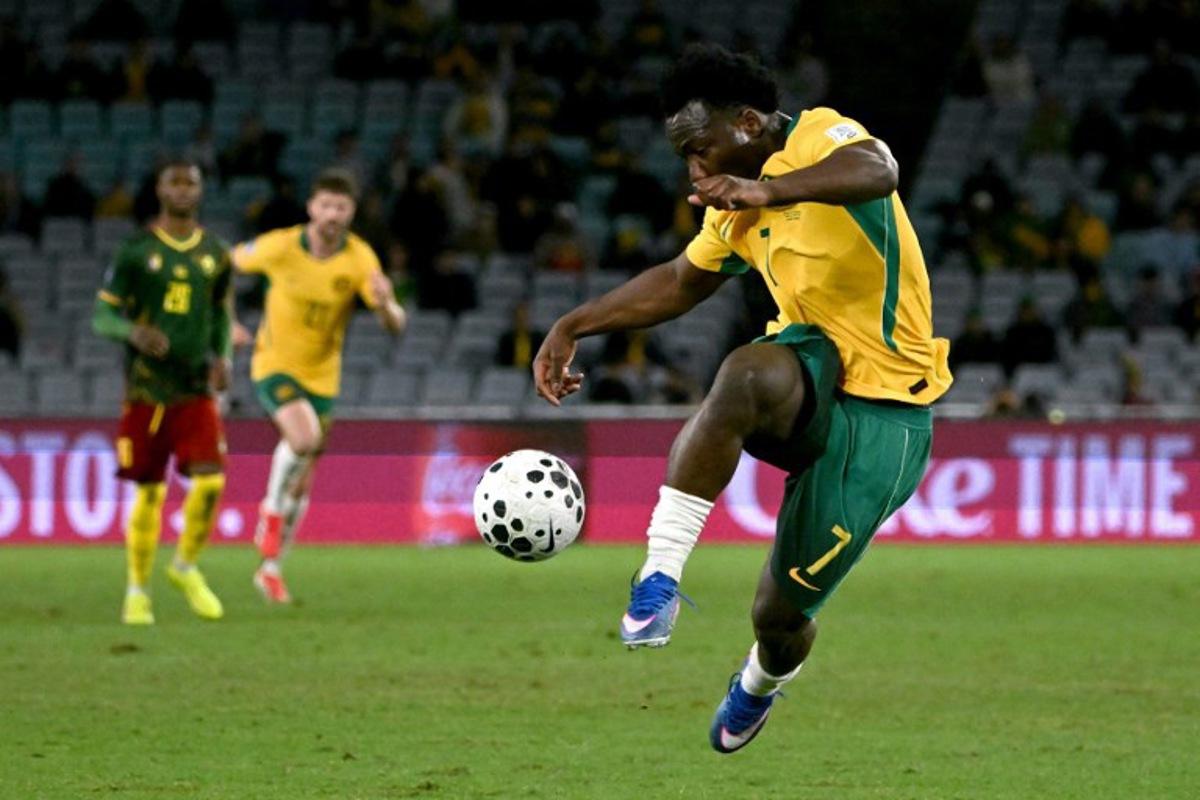 Australia's Nestory Irankunda kicks the ball during the international friendly football match between Australia and Cameroon at Stadium Australia in Sydney on March 27, 2026. SAEED KHAN / AFP