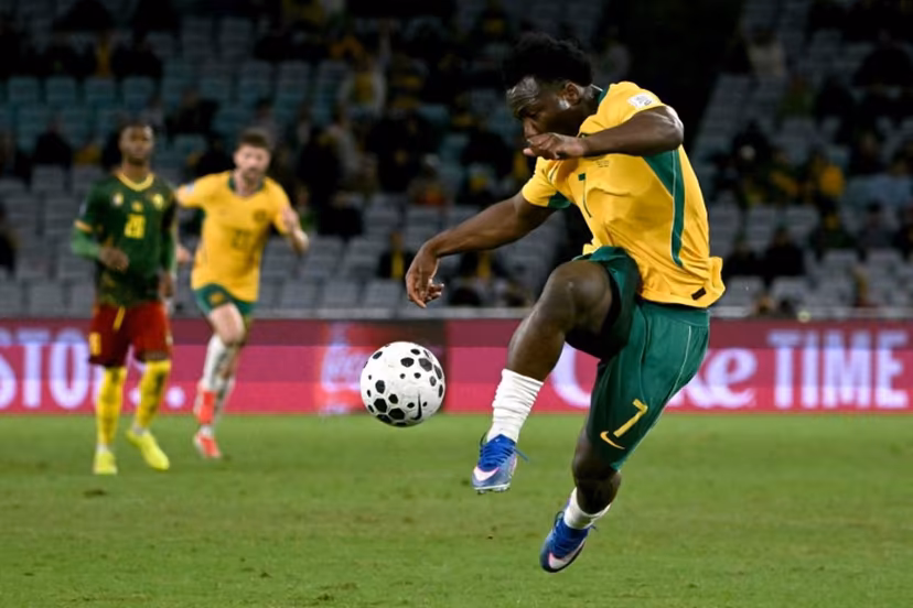Australia's Nestory Irankunda kicks the ball during the international friendly football match between Australia and Cameroon at Stadium Australia in Sydney on March 27, 2026. SAEED KHAN / AFP