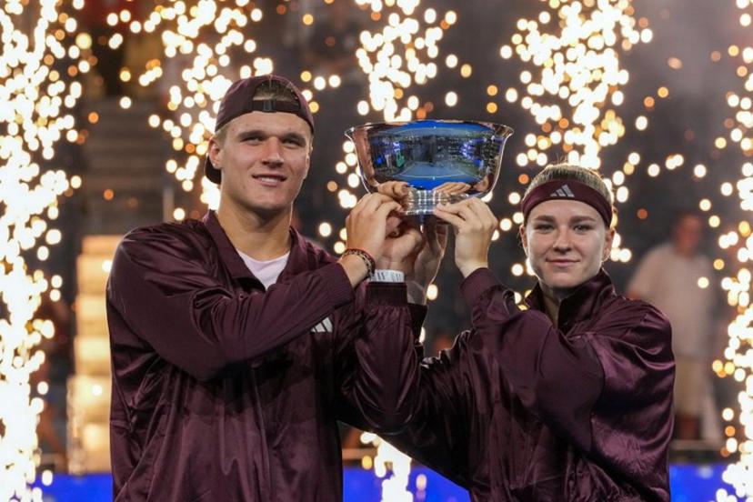 Czech Republic's Jakub Mensik and Czech Republic's Karolina Muchova hold up the trophy after they beat Switzerland's Belinda Bencic and Italy's Flavio Cobolli in the mixed doubles final tennis match of the 2026 US Open tennis tournament at the USTA Billie Jean King National Tennis Center in New York on August 26, 2026. TIMOTHY A. CLARY / AFP