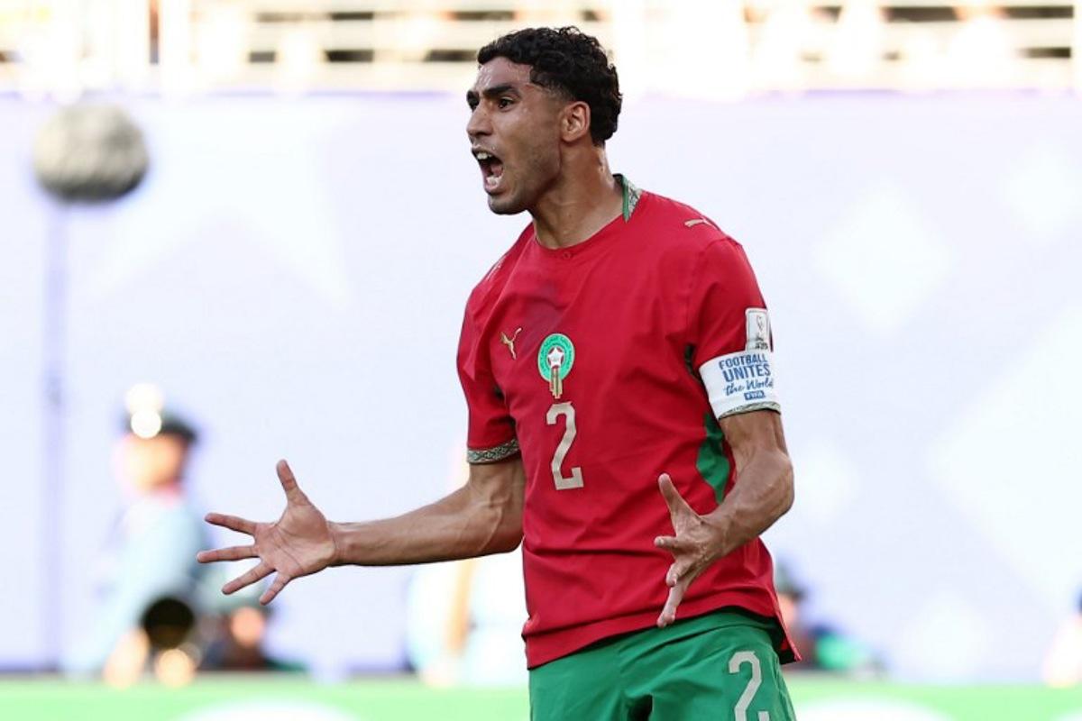 Morocco's defender #02 Achraf Hakimi reacts during the 2026 World Cup Group C football match between Brazil and Morocco at the New York/New Jersey Stadium in East Rutherford on June 13, 2026. CHARLY TRIBALLEAU / AFP