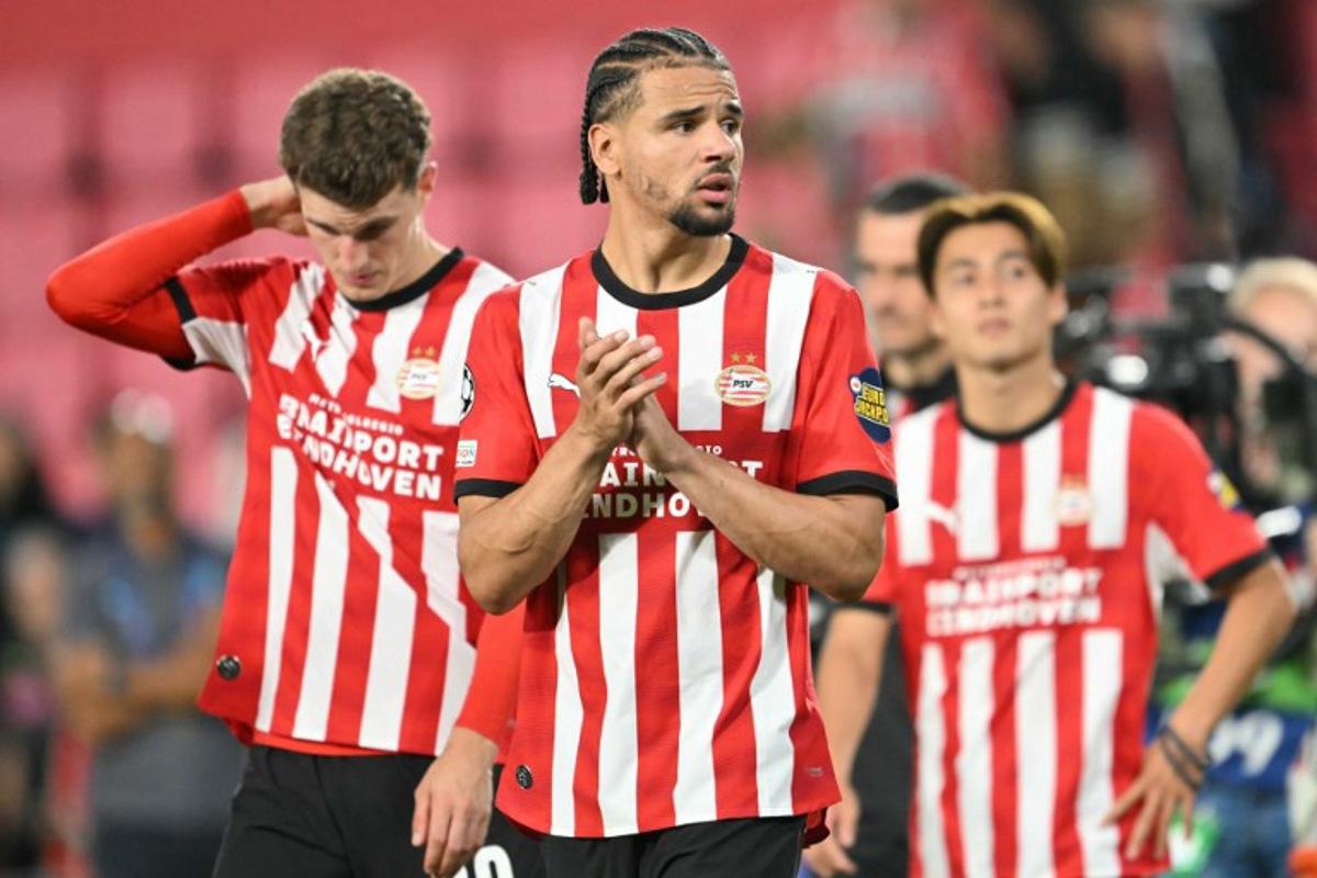 PSV Eindhoven's Curacaoan defender #04 Armando Obispo (C) reacts after a draw in the UEFA Champions League - League phase, Matchday 1 - football match between PSV Eindhoven and FC Shakhtar Donetsk at the Philips Stadium in Eindhoven on September 10, 2026. NICOLAS TUCAT / AFP
