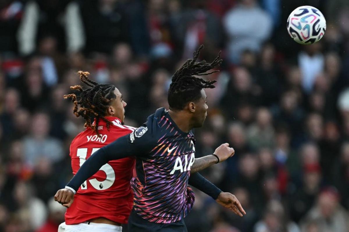 Manchester United's French defender #15 Leny Yoro (L) vies with Tottenham Hotspur's Italian defender #13 Destiny Udogie (R) during the English Premier League football match between Manchester United and Tottenham Hotspur at Old Trafford in Manchester, north west England, on October 10, 2026. Paul ELLIS / AFP