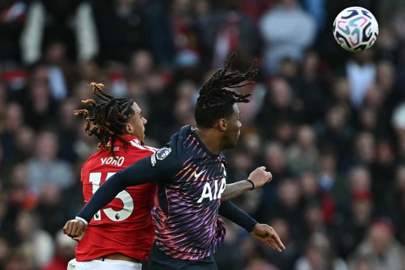 Manchester United's French defender #15 Leny Yoro (L) vies with Tottenham Hotspur's Italian defender #13 Destiny Udogie (R) during the English Premier League football match between Manchester United and Tottenham Hotspur at Old Trafford in Manchester, north west England, on October 10, 2026. Paul ELLIS / AFP