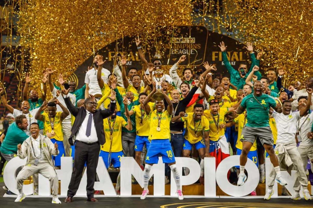 Mamelodi Sundowns' players celebrate with their victory at the end of the CAF Champions League final football match between Mamelodi Sundowns and AS FAR at the Prince Moulay Abdellah Stadium in Rabat on May 24, 2026. Abdel Majid BZIOUAT / AFP