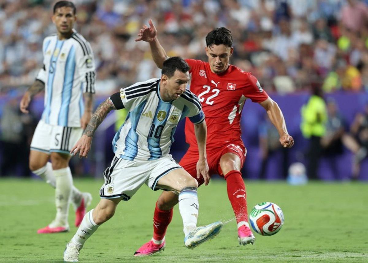 Argentina's forward #10 Lionel Messi and Switzerland's forward #22 Fabian Rieder fight for the ball during the 2026 World Cup football tournament quarter-final match between Argentina and Switzerland at the Kansas City Stadium in Kansas City on July 11, 2026. Thomas COEX / AFP