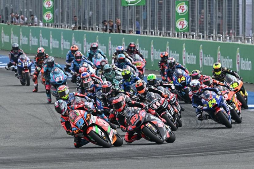 Riders take the start of the Moto2 race at the MotoGP Thailand Grand Prix at the Buriram International Circuit in Buriram on March 2, 2025. MOHD RASFAN / AFP
