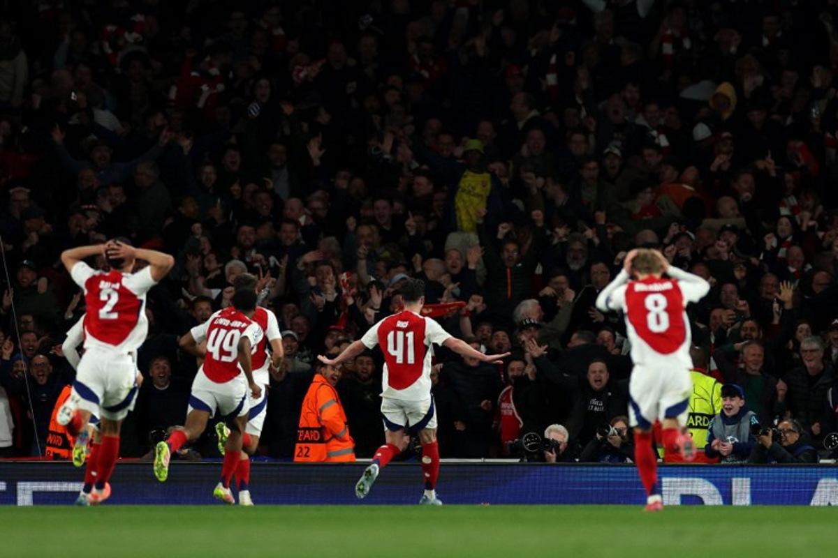 Arsenal's English midfielder #41 Declan Rice celebrates scoring the team's second goal during the UEFA Champions League Quarter final first leg football match between Arsenal and Real Madrid, at the Emirates Stadium, in London, on April 8, 2025. Adrian Dennis / AFP
