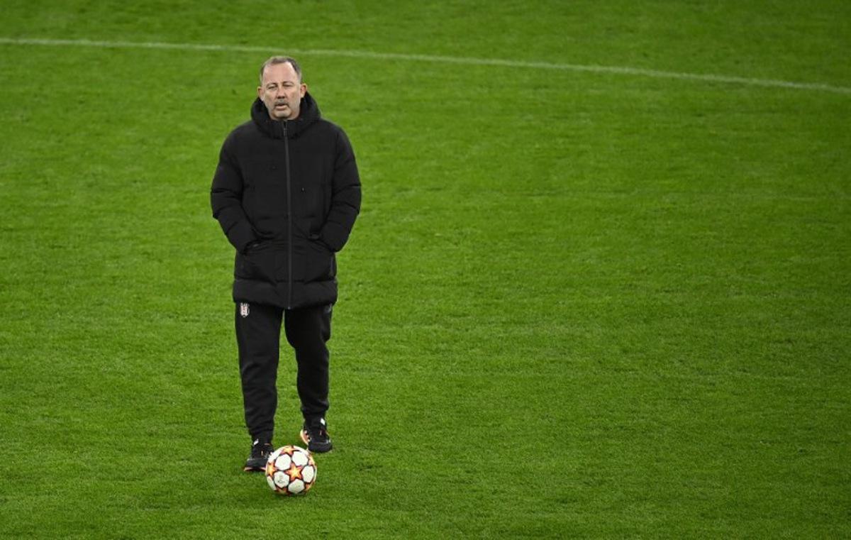 Besiktas' Turkish coach Sergen Yalcin overses a training session at the Signal-Iduna Park in Dortmund, western Germany, on December 6, 2021, on the eve of their UEFA Champions League Group C football match against Borussia Dortmund. Ina FASSBENDER / AFP