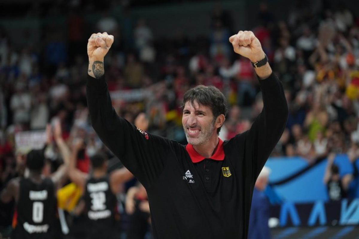 Germany's Spanish head coach Alex Mumbru celebrates after winning the FIBA EuroBasket 2025 final basketball match between Turkey and Germany in Riga, Latvia, on September 12, 2025. Gints Ivuskans / AFP