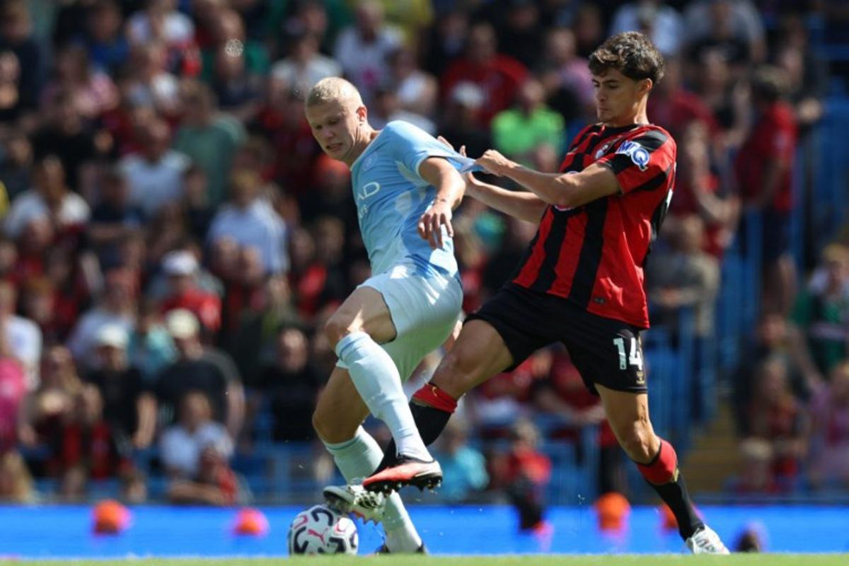 Manchester City's Norwegian striker #09 Erling Haaland (L) vies with Bournemouth's Portugese defender #14 Antonio Silva (R) during the English Premier League football match between Manchester City and AFC Bournemouth at the Etihad Stadium in Manchester, north west England, on August 23, 2026. Darren Staples / AFP