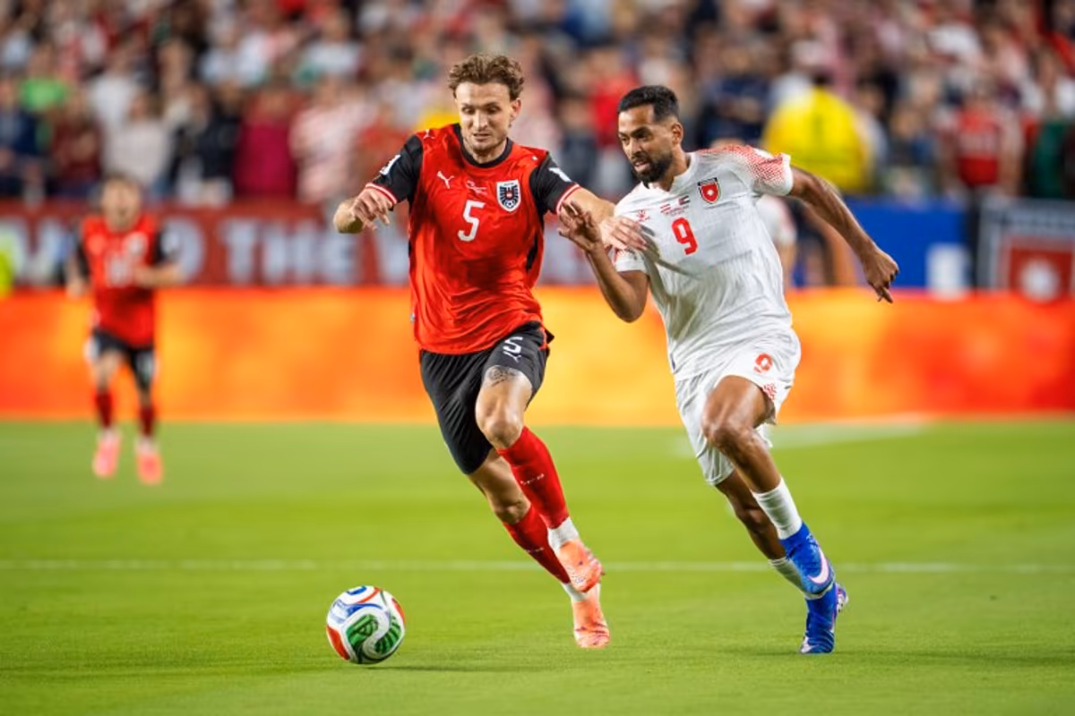Austria's defender #05 Stefan Posch and Jordan's forward #09 Ali Olwan fight for the ball during the 2026 World Cup Group J football match between Austria and Jordan at the San Francisco Bay Area Stadium in Santa Clara, on June 16, 2026. GEORG HOCHMUTH / APA / AFP