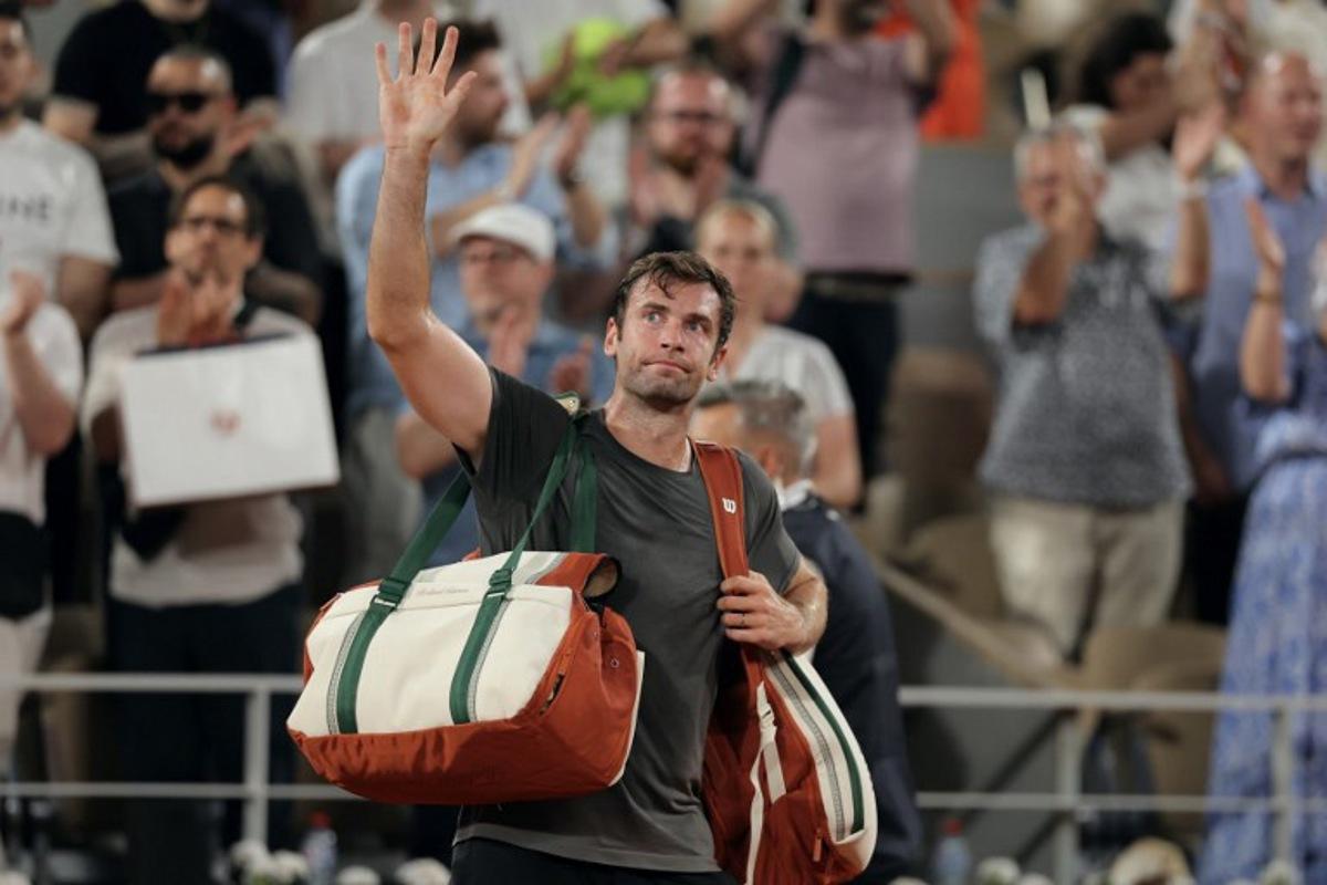 France's Quentin Halys waves as he leaves the court after being defeated by Germany's Alexander Zverev at the end of their men's singles match on day 6 of the French Open tennis tournament on Court Philippe-Chatrier at the Roland-Garros Complex in Paris on May 29, 2026. Thomas SAMSON / AFP