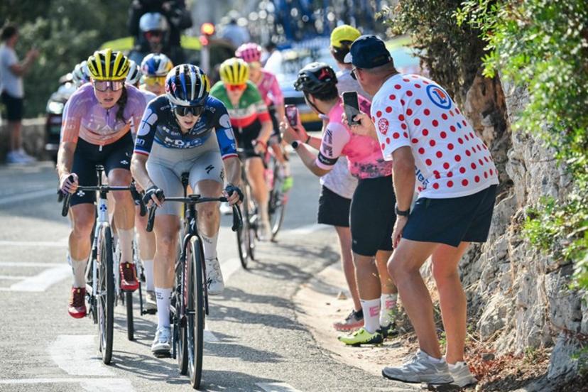 FDJ-SUEZ's French rider Juliette Berthet (C) and UAE Team ADQ's Spanish rider Paula Blasi (L) ride in the peloton in the Col d'Eze during the 9th and final stage of the fifth edition of the Women's Tour de France cycling race, 99.2 km from Nice to Nice, southeastern France on August 9, 2026. NICOLAS TUCAT / AFP