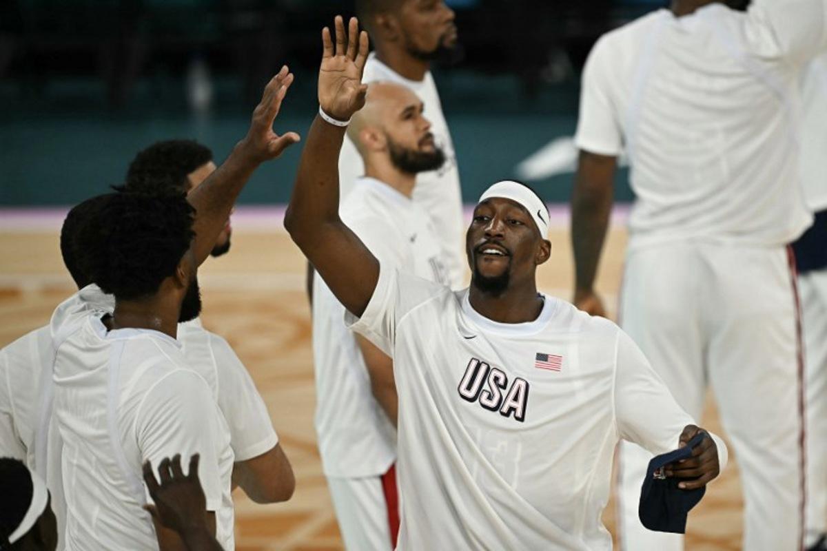 USA's #13 Bam Adebayo high fives teammates before the men's Gold Medal basketball match between France and USA during the Paris 2024 Olympic Games at the Bercy Arena in Paris on August 10, 2024. Paul ELLIS / AFP