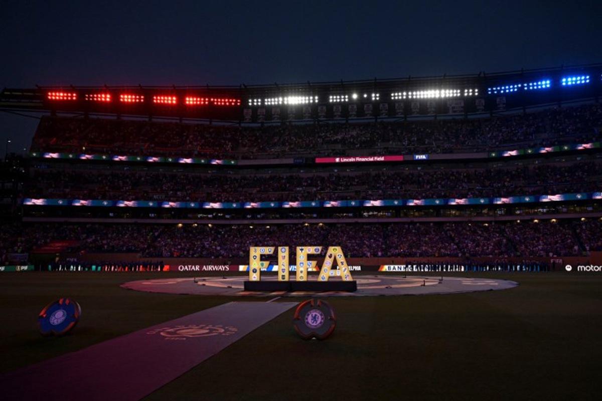 A FIFA logo is seen on the pitch ahead of the FIFA Club World Cup 2025 quarterfinal football match between Brazil's Palmeiras and England's Chelsea at the Lincoln Financial Field Stadium in Philadelphia on July 4, 2025. JUAN MABROMATA / AFP
