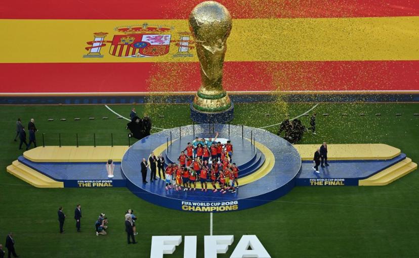 Spain's players celebrate with the trophy during the final ceremony after the 2026 World Cup football tournament final match between Spain and Argentina at the New York/New Jersey Stadium in East Rutherford on July 19, 2026. ANGELA WEISS / AFP