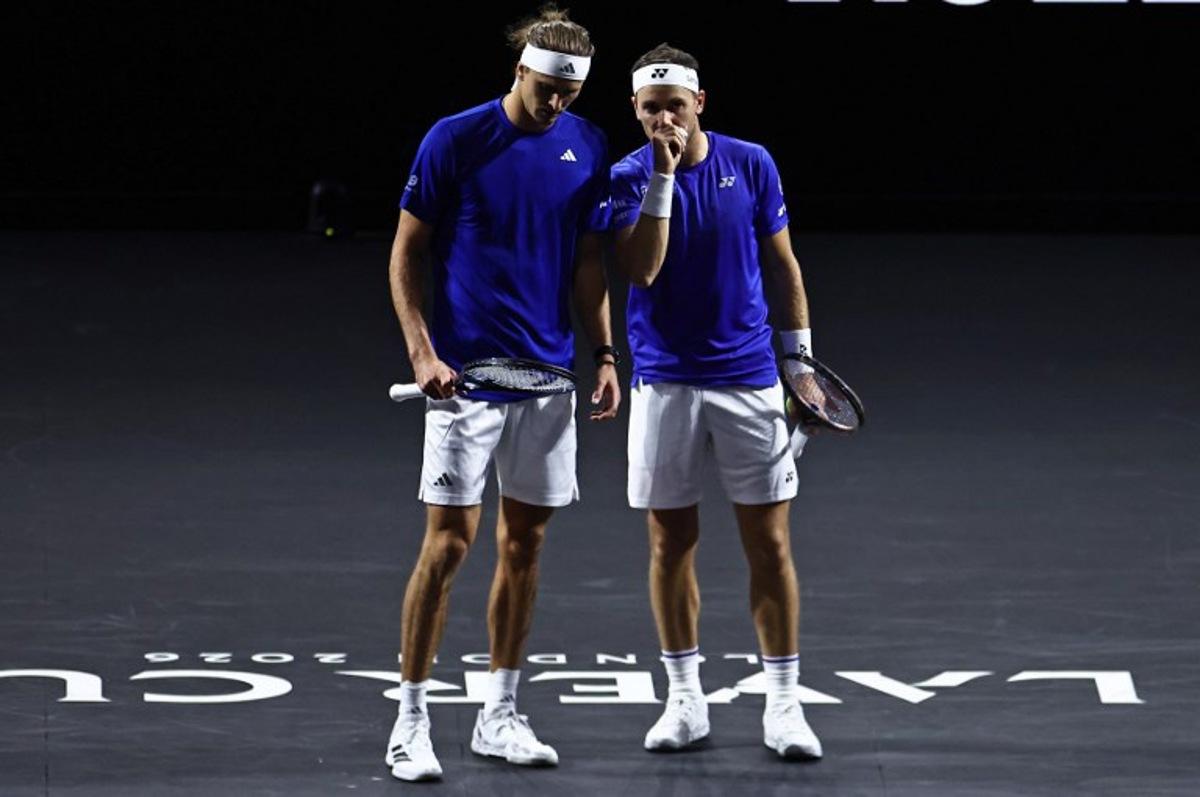 Germany's Alexander Zverev playing with Norway's Casper Ruud for Team Europe look on whilst against USA's Brandon Nakashima and Kazakhstan's Alexander Bublik of Team World during their 2026 Laver Cup men's doubles tennis match, at the O2 Arena in London on September 26, 2026. Henry Nicholls / AFP