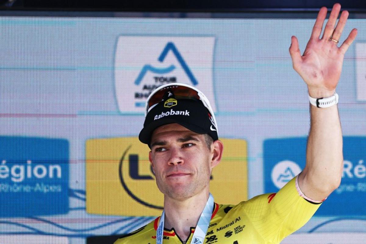 Stage winner Team Visma | Lease a Bike's Belgian rider Wout Van Aert celebrates on the podium of the 5th stage of the Tour Auvergne-Rhone-Alpes cycling race (formerly known as the Criterium du Dauphine), 195,8km between Saint-Chamond and Villars-les-Dombes, central France, on June 11, 2026. Anne-Christine POUJOULAT / AFP