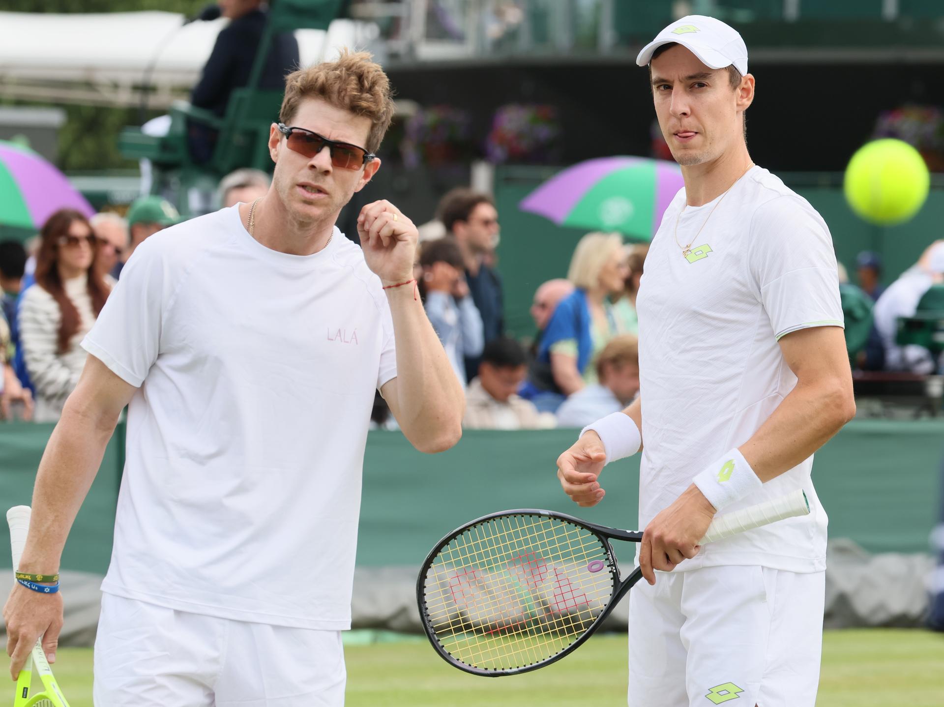 Uruguayan Ariel Behar and Belgian Joran Vliegen pictured during a doubles tennis match against Italian pair Vavassori - Bolelli, in the first round of the men's doubles at the 2025 Wimbledon grand slam tournament, Wednesday 02 July 2025 at the All England Tennis Club, in South-West London, Britain. BELGA PHOTO BENOIT DOPPAGNE