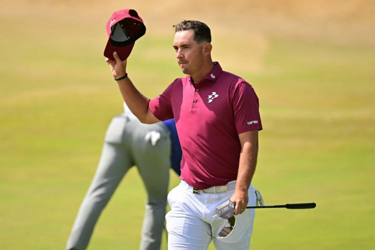 Australia's Lucas Herbert reacts on the 18th green after his -8, 62, tying the Open Championship low score record on day two of the 154th Open Golf championship at Royal Birkdale Golf Club near Southport in north-west England on July 17, 2026. ANDY BUCHANAN / AFP