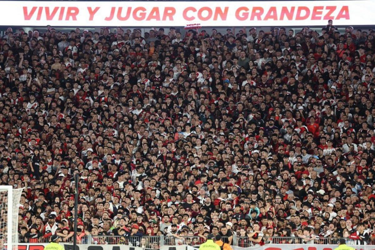 River Plate fans are pictured during the Argentine Professional Football League 2025 Clausura Tournament match between River Plate and Gimnasia at the Mas Monumental Stadium in Buenos Aires on November 2, 2025. ALEJANDRO PAGNI / AFP