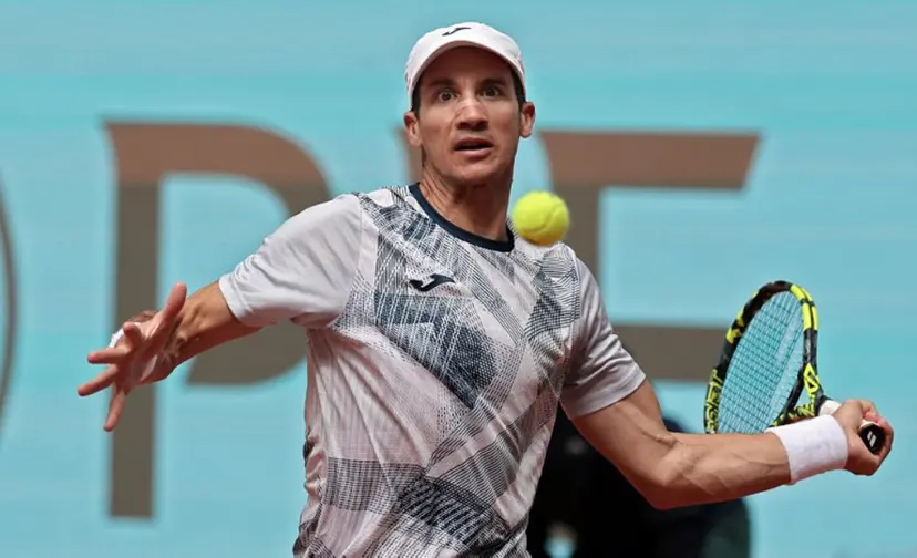 Argentina's Facundo Bagnis returns the ball to Russia's Andrey Rublev during the 2024 ATP Tour Madrid Open tennis tournament singles match at Caja Magica in Madrid on April 26, 2024. Thomas COEX / AFP