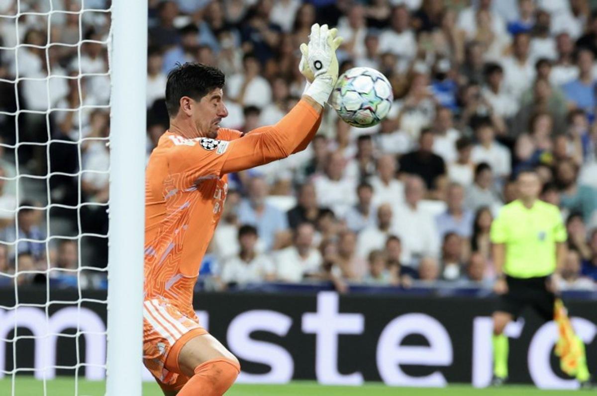 Real Madrid's Belgian goalkeeper #01 Thibaut Courtois makes a save during the UEFA Champions League first round day 1 football match between Real Madrid and Inter Milan at the Santiago Bernabeu stadium in Madrid on September 8, 2026. Thomas COEX / AFP