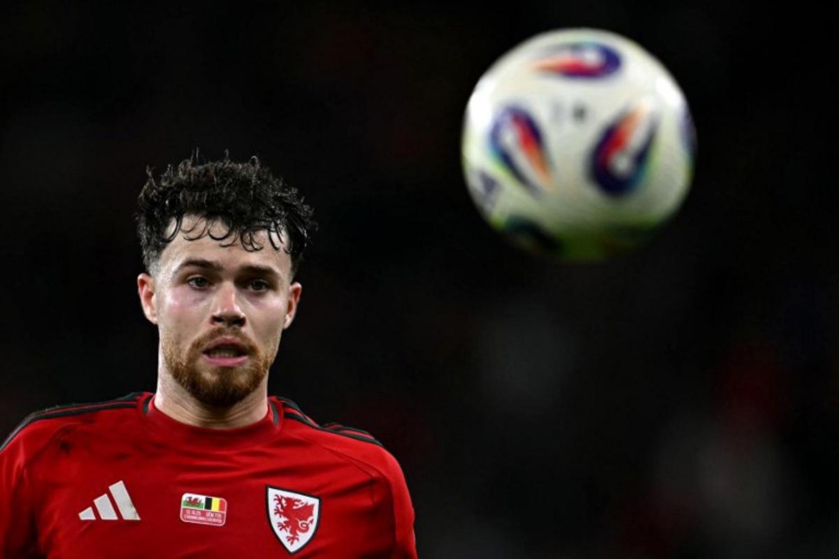 Wales' defender Neco Williams focuses on the ball during the 2026 World Cup Group J qualifier football match between Wales and Belgium, at Cardiff City Stadium, in Cardiff, on October 13, 2025. Paul ELLIS / AFP
