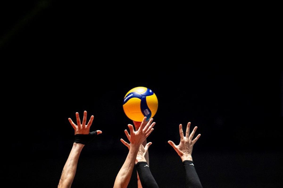 Puerto Rico's Paola Rojas (front L) and Brittany Abercrombie (front R) attempt to block a shot by Turkey's Ebrar Karakurt during the Volleyball World Cup 2023 women's match between Turkey and Puerto Rico in Tokyo on September 16, 2023. Philip FONG / AFP