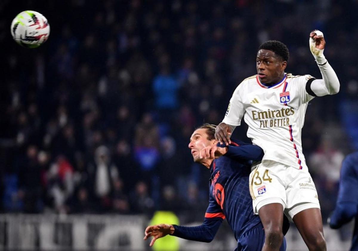 Lyon's French midfielder #34 Mahamadou Diawara (R) fights for the ball with Lille's Turkish midfielder #12 Yusuf Yazici (L) during the French L1 football match between Olympique Lyonnais (Lyon) and LOSC (Lille) at the Groupama stadium in Lyon, central eastern France on November 26, 2023. ARNAUD FINISTRE / AFP