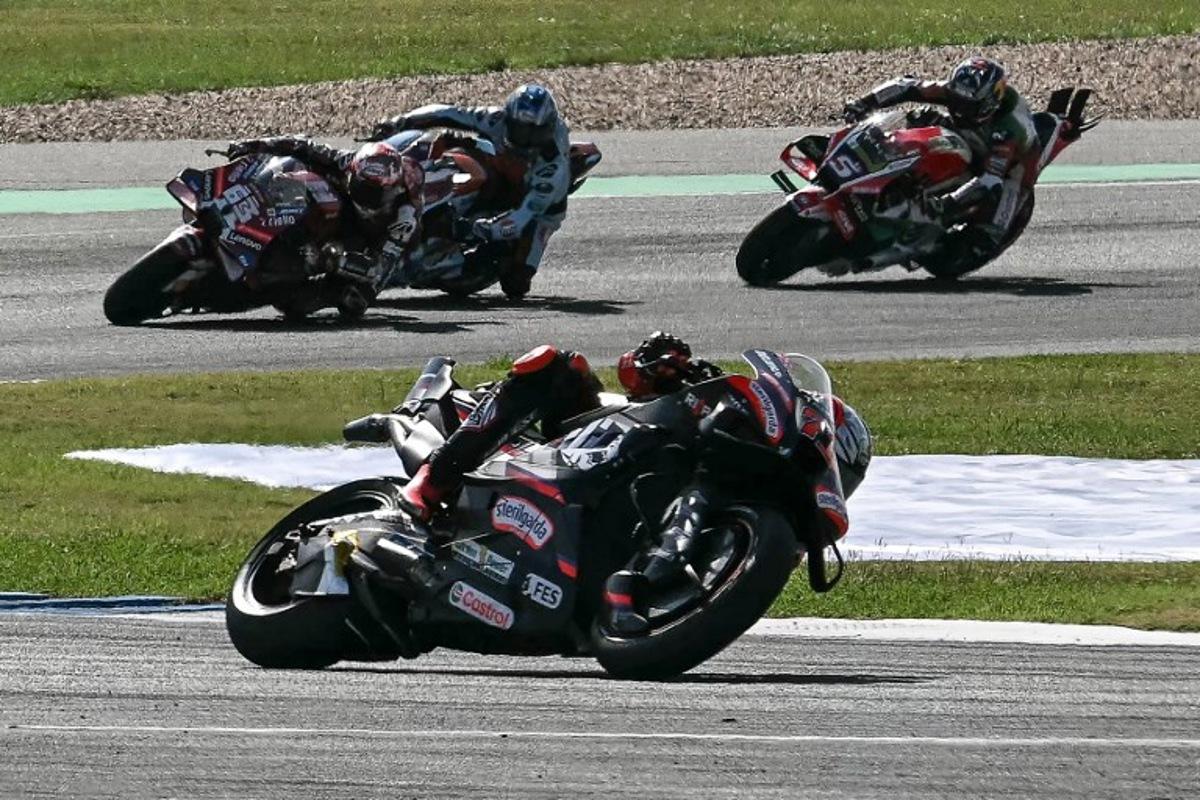 Aprilia Racing's Italian rider Marco Bezzecchi (C) competes during the MotoGP Thailand Grand Prix at the Buriram International Circuit in Buriram on March 1, 2026. Lillian SUWANRUMPHA / AFP