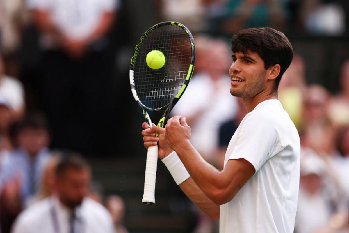 Spain's Carlos Alcaraz reacts as he plays against Italy's Jannik Sinner during their men's singles final tennis match on the fourteenth day of the 2025 Wimbledon Championships at The All England Lawn Tennis and Croquet Club in Wimbledon, southwest London, on July 13, 2025. HENRY NICHOLLS / AFP