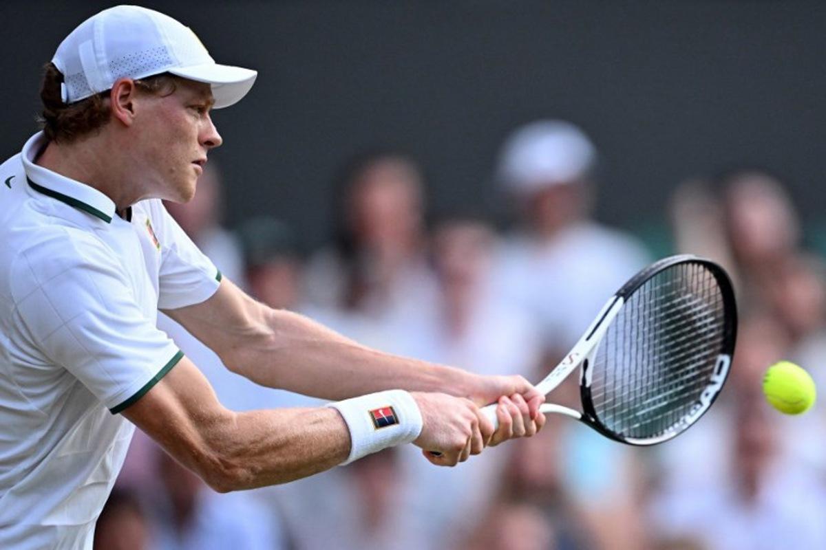 Italy's Jannik Sinner returns to Japan's Shintaro Mochizuki during their men's singles round of 16 tennis match on the seventh day of the 2026 Wimbledon Championships at The All England Lawn Tennis and Croquet Club in Wimbledon, southwest London, on July 5, 2026. Kirill KUDRYAVTSEV / AFP