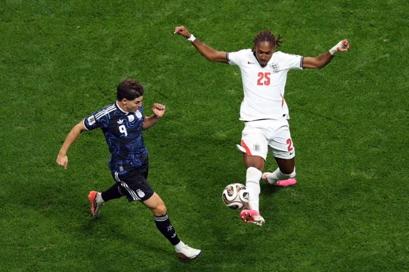 England's defender #25 Djed Spence and Argentina's forward #09 Julian Alvarez fight for the ball during the 2026 World Cup football tournament semi-final match between England and Argentina at the Atlanta Stadium in Atlanta on July 15, 2026. PATRICIA DE MELO MOREIRA / AFP