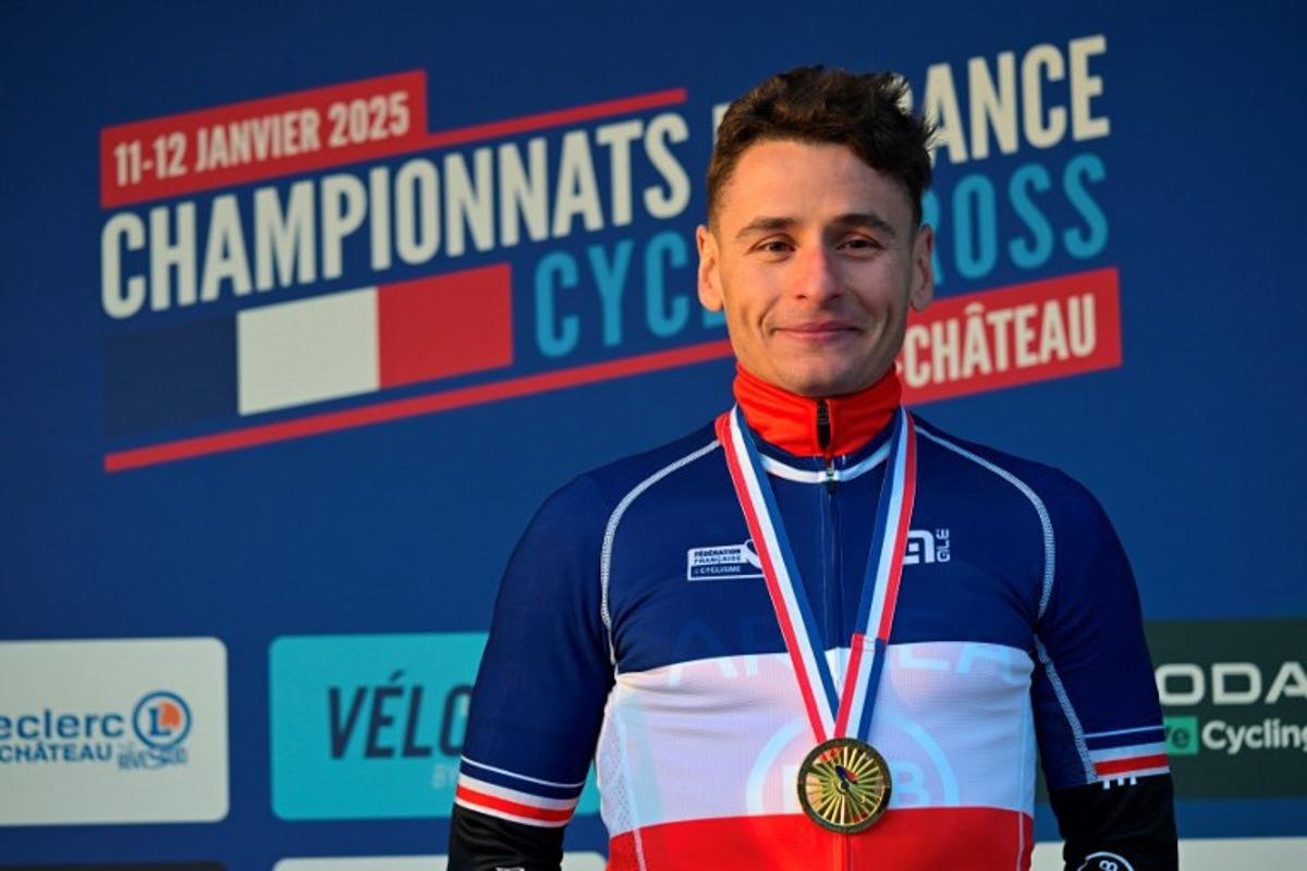 Gold medalist Clement Venturini celebrates during the podium ceremony of the France's men cyclo-cross French men's elite cyclo cross Championships in Pontchateau, western France on January 12, 2025. Damien MEYER / AFP