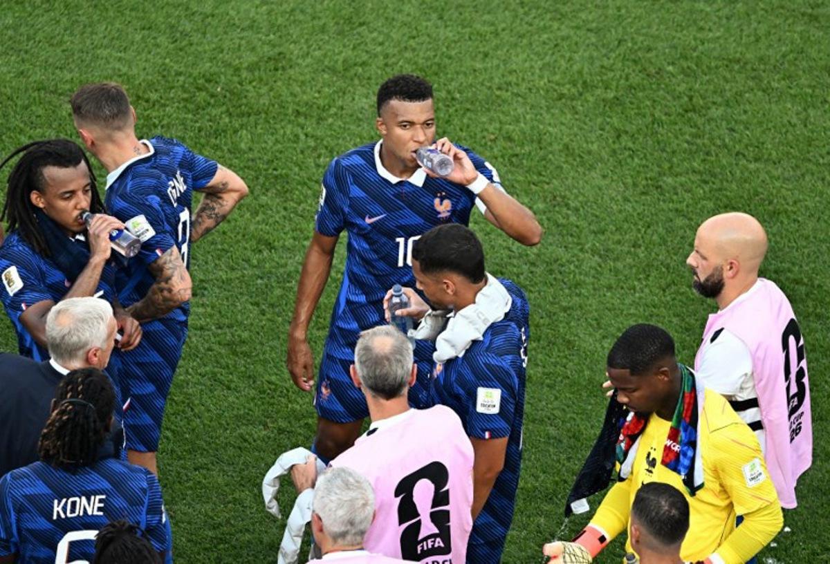 France's forward #10 Kylian Mbappe and teammates take the hydration break during the 2026 World Cup round of 16 football match between Paraguay and France at the Philadelphia Stadium in Philadelphia on July 4, 2026. Jewel SAMAD / AFP