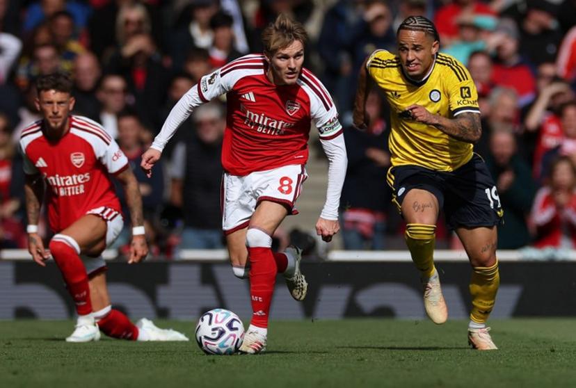 Leeds United's Swiss striker #19 Noah Okafor (R) chases down Arsenal's Norwegian midfielder #08 Martin Odegaard during the English Premier League football match between Arsenal and Leeds United at the Emirates Stadium in London on October 10, 2026. Adrian Dennis / AFP