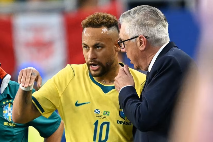 Brazil's Italian head coach Carlo Ancelotti talks to his forward #10 Neymar during the 2026 World Cup Group C football match between Scotland and Brazil at the Miami Stadium in Miami Gardens on June 24, 2026. CHANDAN KHANNA / AFP