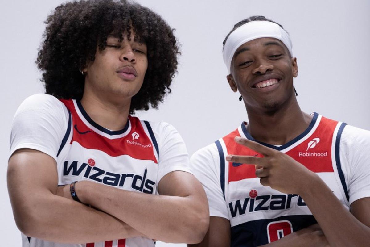 Bilal Coulibaly (R), French basketball player for the Washington Wizards, jokes around with Swiss teammate Kyshawn George at Wizards media day ahead of the NBA season at Capital One Arena in Washington, DC, September 30, 2024. ROBERTO SCHMIDT / AFP