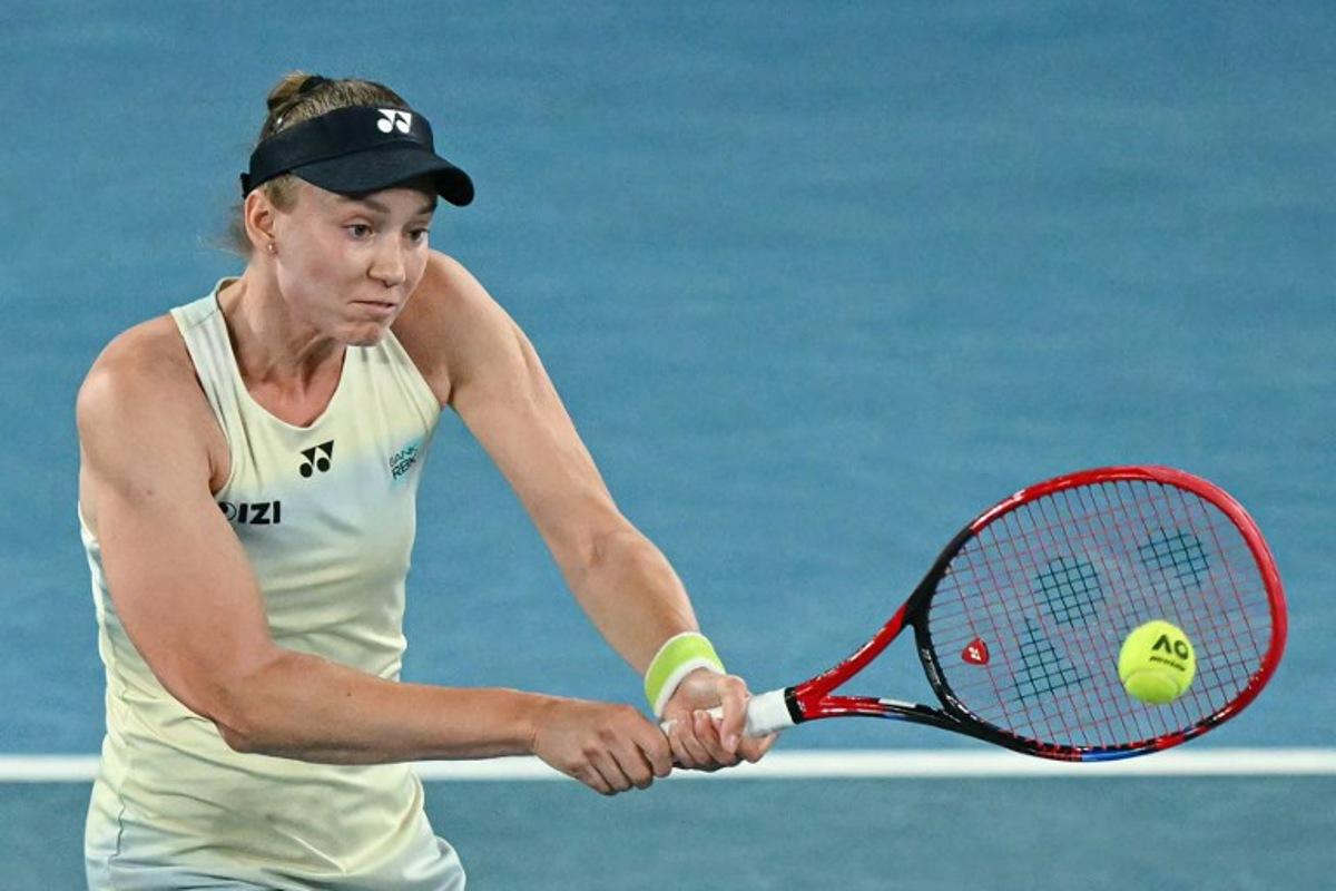 Kazakhstan's Elena Rybakina hits a return against USA's Jessica Pegula during their women's singles semi-final match on day twelve of the Australian Open tennis tournament in Melbourne on January 29, 2026. WILLIAM WEST / AFP