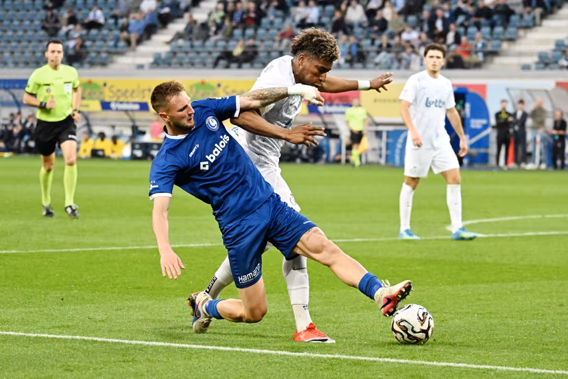 Gent's Siebe Van der Heyden and Union's Kevin Rodriguez fight for the ball during a soccer match between KAA Gent and Royale Union Saint-Gilloise, Thursday 21 May 2026 in Gent, on the ninth day of the Champion's Play-offs of the 2025-2026 'Jupiler Pro League' first division of the Belgian championship. BELGA PHOTO MAARTEN STRAETEMANS