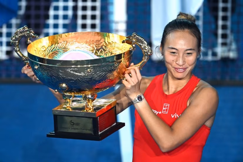 China's Zheng Qinwen celebrates with the trophy after beating Russia's Mirra Andreeva in the women's singles final at the China Open tennis tournament in Beijing on October 11, 2026. Greg Baker / AFP