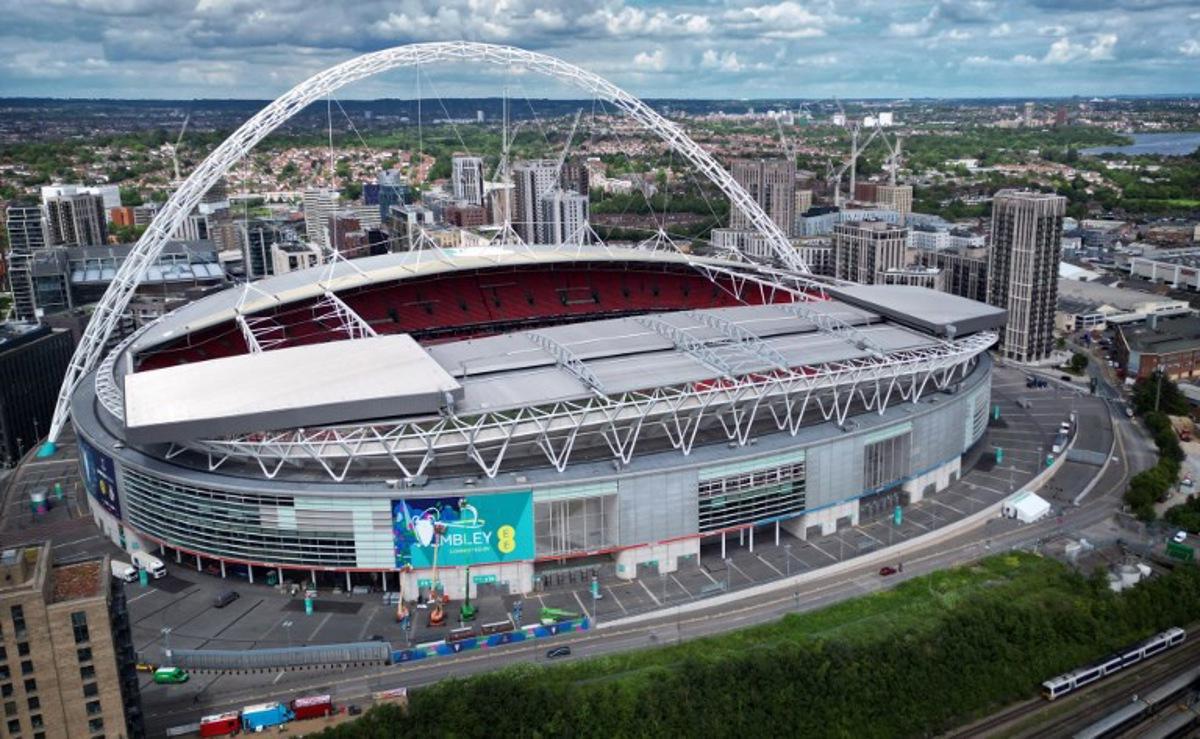 An aerial view taken on May 29, 2024, shows branding being attached to the outside of Wembley Stadium, venue for the UEFA Champions League final football match between Borussia Dortmund and Real Madrid, to be played in London on June 1, 2024. Paul ELLIS / AFP