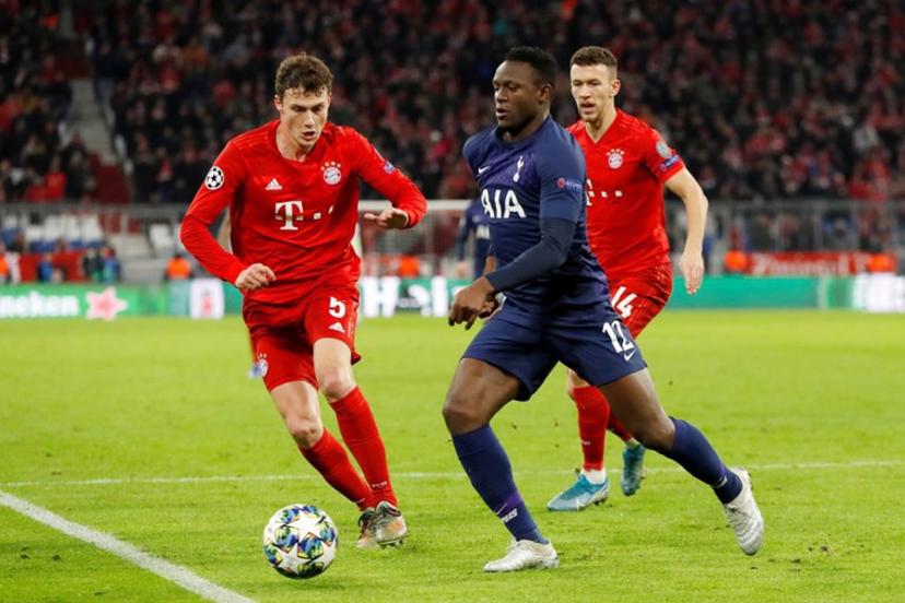 Tottenham Hotspur's Kenyan midfielder Victor Wanyama (C) and Bayern Munich's French defender Benjamin Pavard vie for the ball during the UEFA Champions League Group B football match between Bayern Munich and Tottenham FC on December 11, 2019 in Munich, Germany. Odd ANDERSEN / AFP